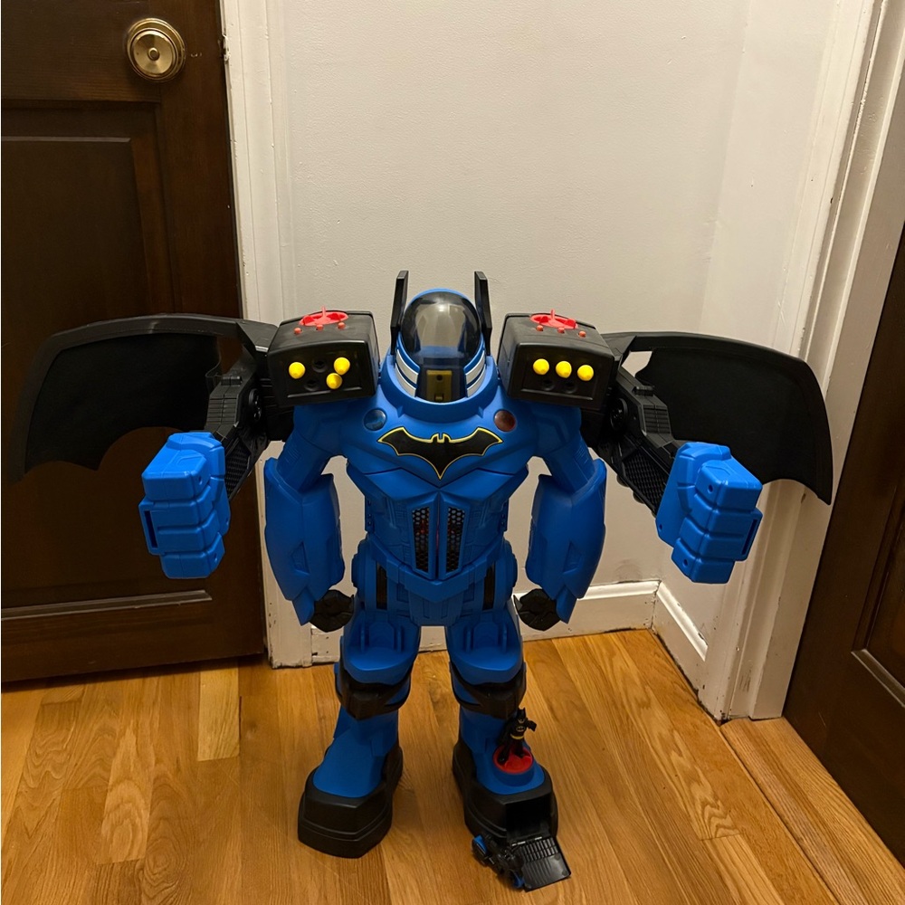 Blue Batman Action Figure with Black Wings. Missing a few bullets